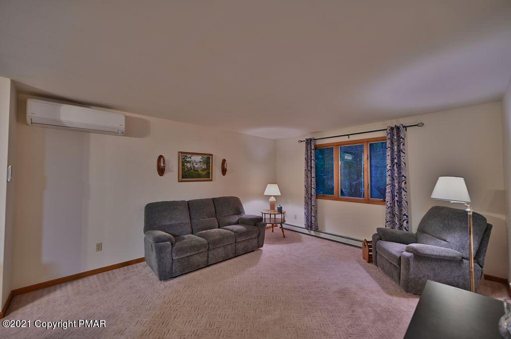 168 Shenkel Road Effort, PA 18330 - Photo 9 of 64 a living room with furniture and a window