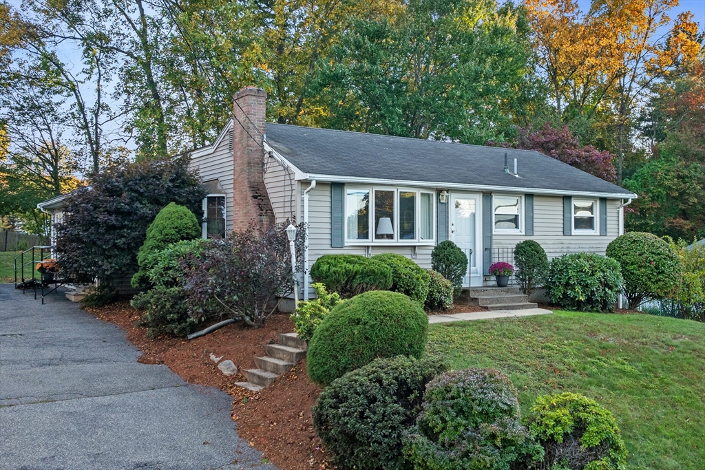 28 Robinson Road Woburn, MA 01801 - Photo 1 of 42 a front view of a house with a yard
