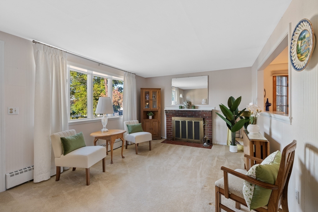 28 Robinson Road Woburn, MA 01801 - Photo 24 of 42 a living room with furniture and a potted plant