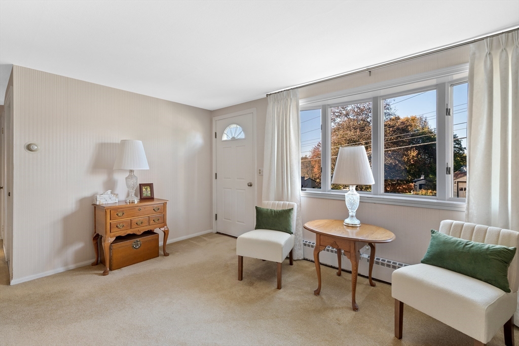 28 Robinson Road Woburn, MA 01801 - Photo 27 of 42 a living room with furniture and a window