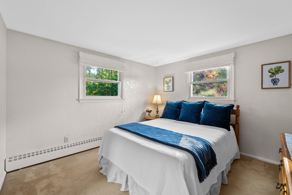 28 Robinson Road Woburn, MA 01801 - Photo 28 of 42 a bedroom with a bed and a window