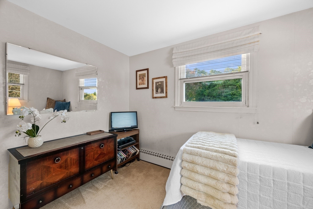 28 Robinson Road Woburn, MA 01801 - Photo 32 of 42 a bedroom with a bed and a window