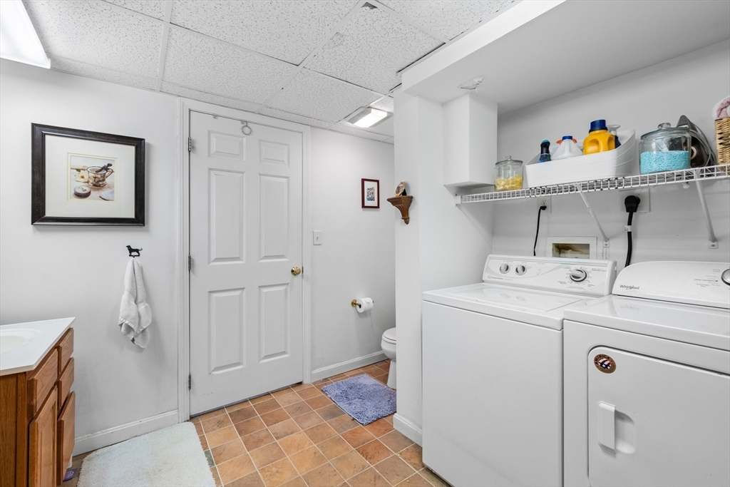 28 Robinson Road Woburn, MA 01801 - Photo 40 of 42 a view of storage room with washer and dryer
