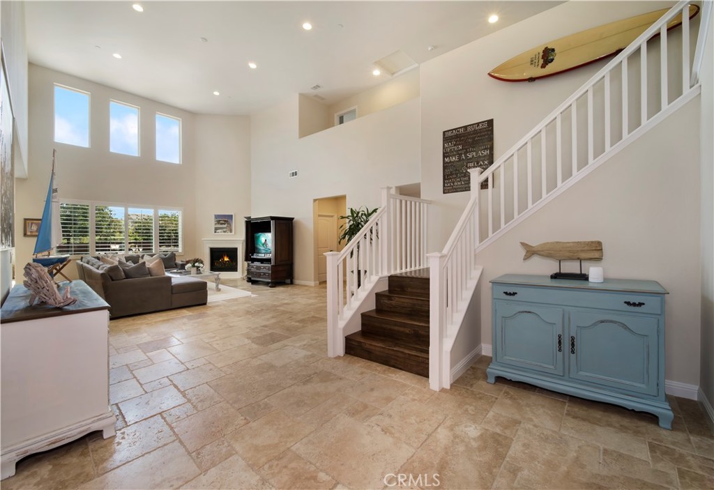5572 Thoroughbred Street Oceanside, CA 92057 - Photo 2 of 38 a living room with furniture and stairs