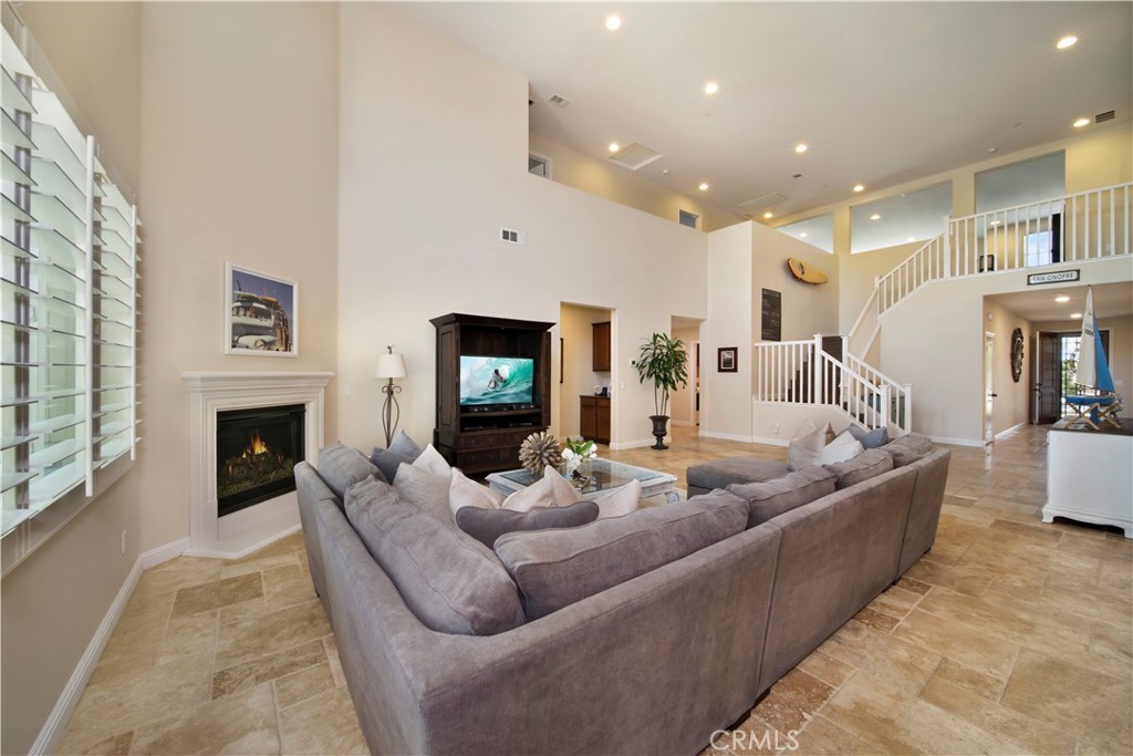 5572 Thoroughbred Street Oceanside, CA 92057 - Photo 4 of 38 a living room with furniture and a fireplace