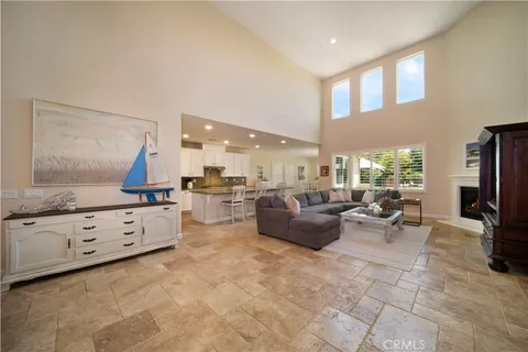a living room with fireplace furniture and a flat screen tv