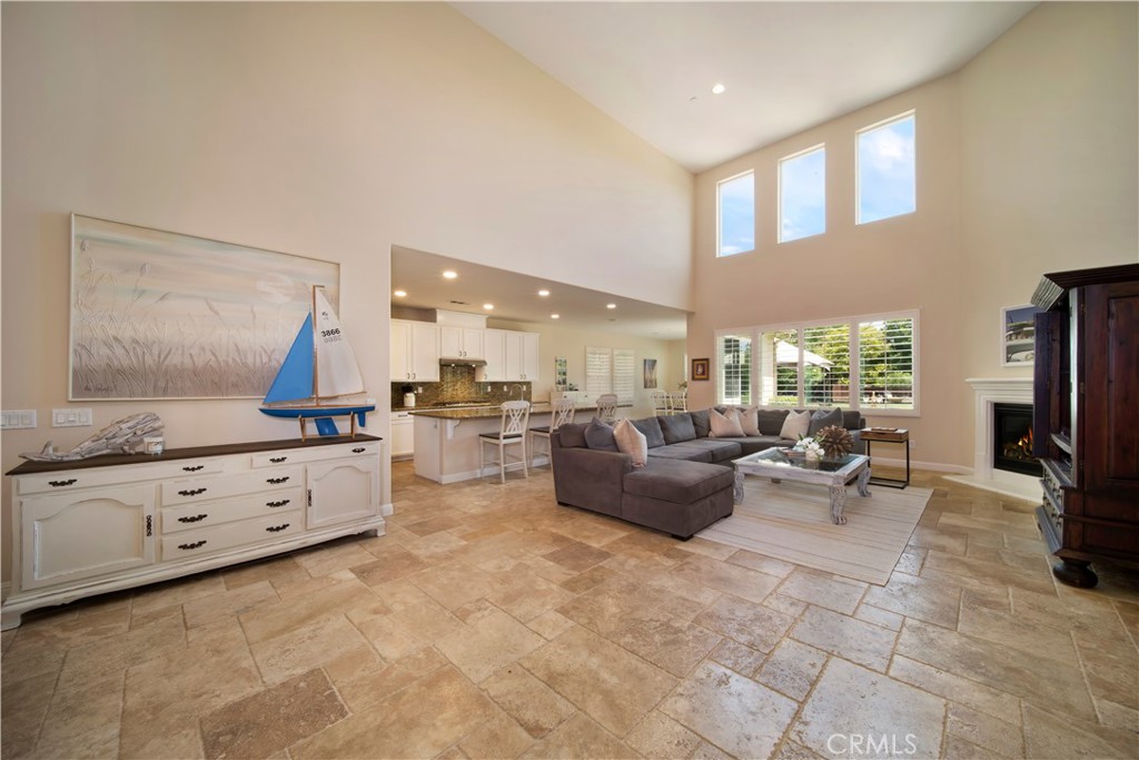 5572 Thoroughbred Street Oceanside, CA 92057 - Photo 5 of 38 a living room with fireplace furniture and a flat screen tv