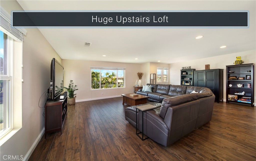 5572 Thoroughbred Street Oceanside, CA 92057 - Photo 6 of 38 a living room with furniture and a wooden floor