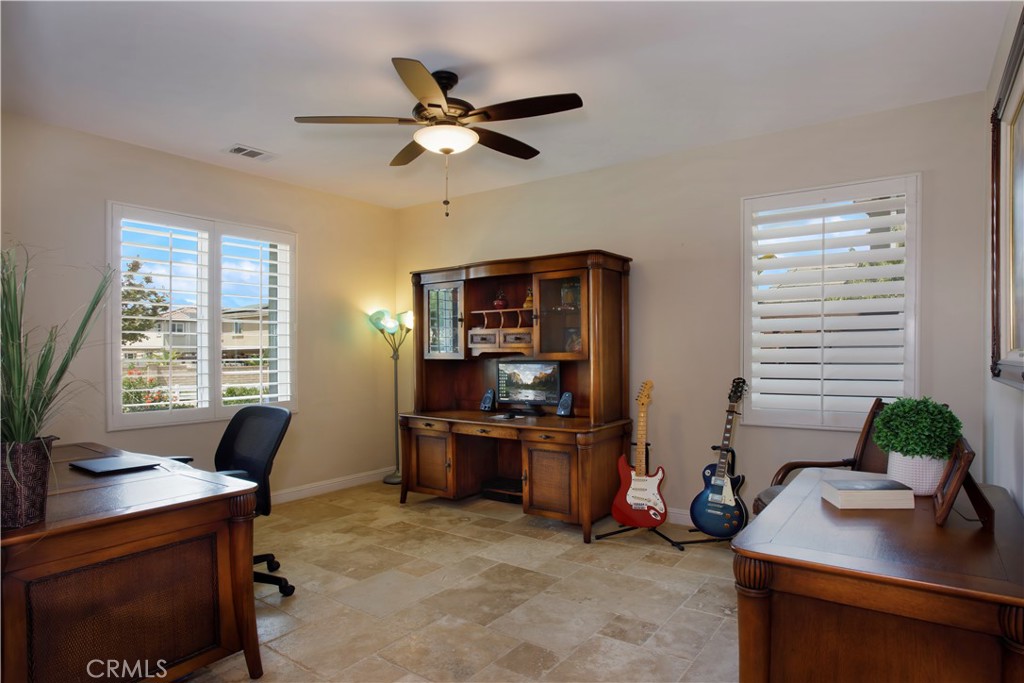 5572 Thoroughbred Street Oceanside, CA 92057 - Photo 7 of 38 a view of a workspace with furniture and a window