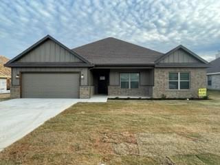 a front view of a house with yard