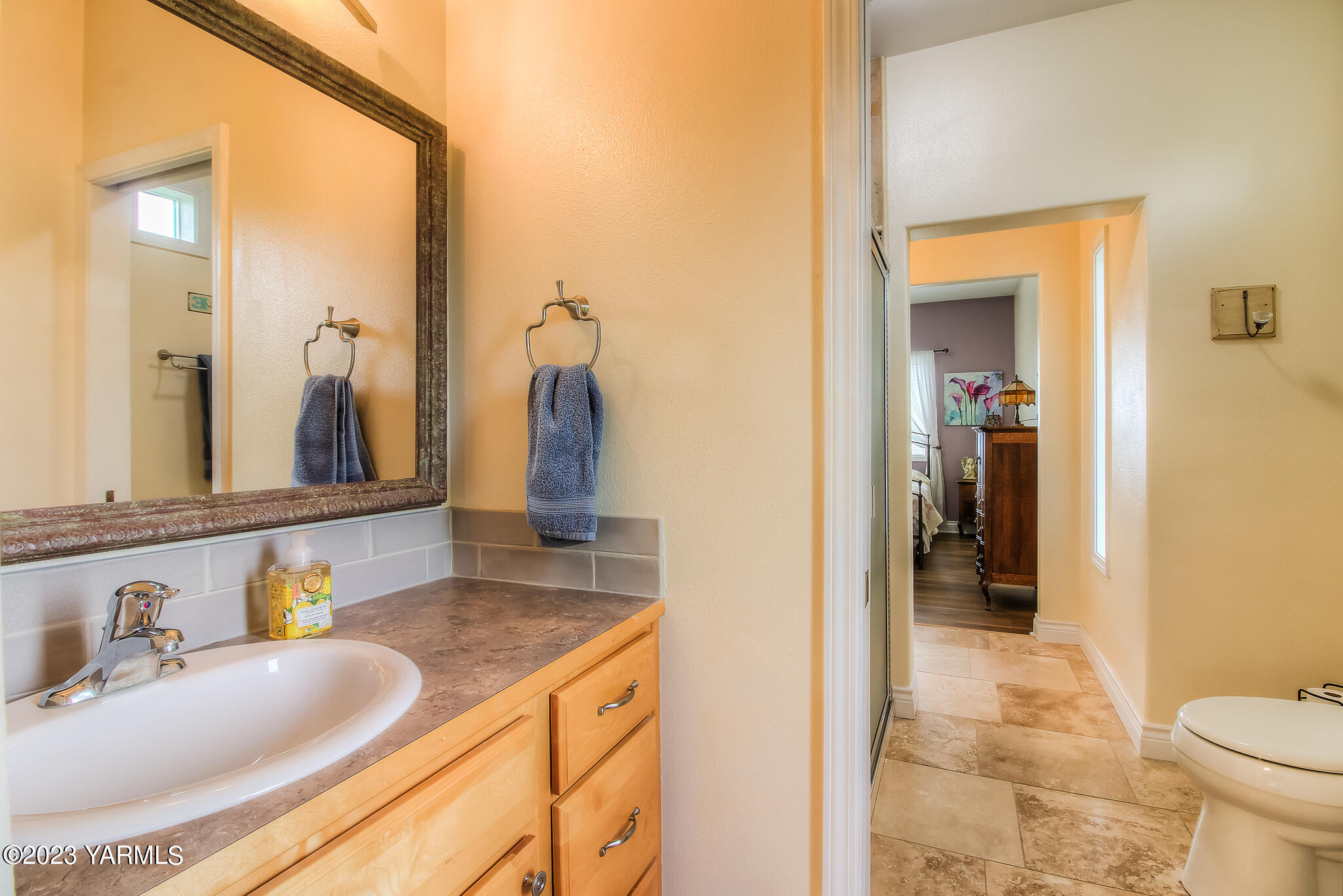 893 Charvet Road Grandview, WA 98930 - Photo 15 of 44 a bathroom with a granite countertop sink and a mirror
