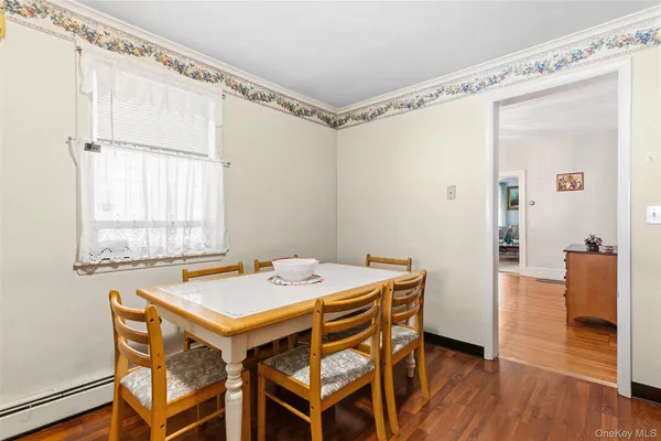a dining room with a table and chairs
