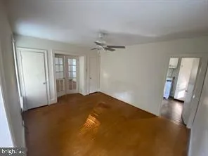 a view of a big room with windows and cabinet
