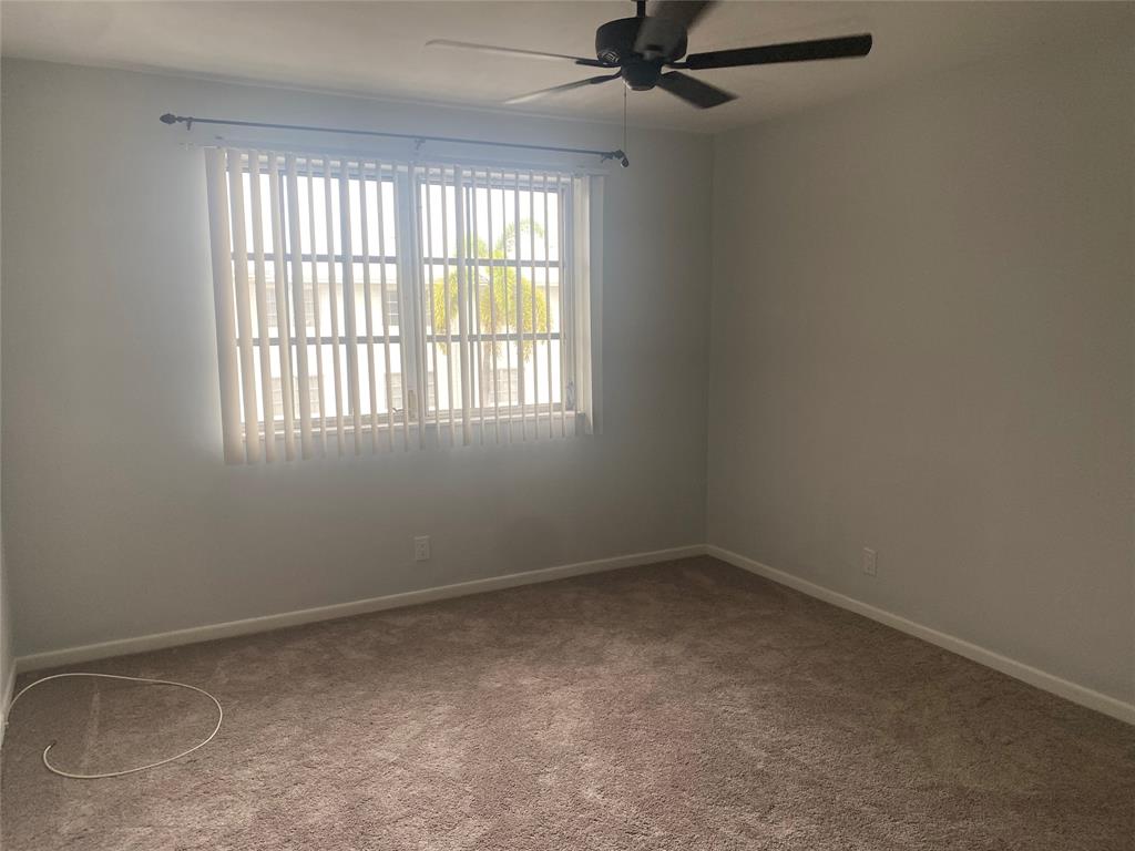 1821 Northeast 62nd Street, Unit 432 Fort Lauderdale, FL 33308 - Photo 11 of 29 an empty room with a window