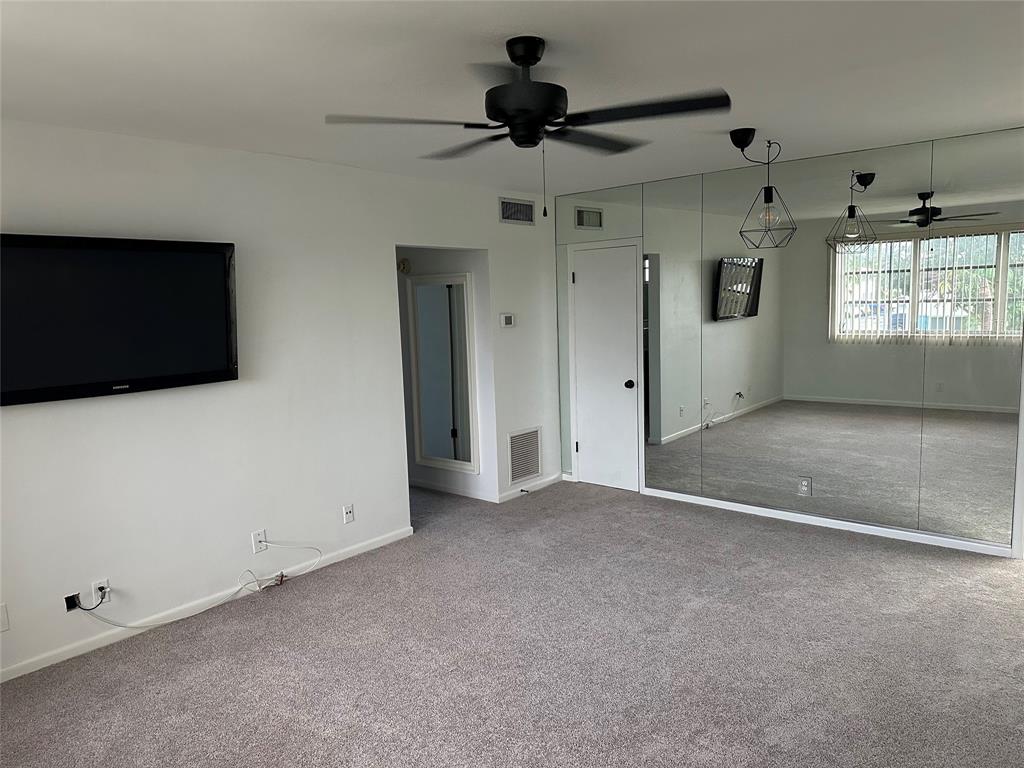 1821 Northeast 62nd Street, Unit 432 Fort Lauderdale, FL 33308 - Photo 2 of 29 a view of an empty room with a window