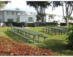 1821 Northeast 62nd Street, Unit 432 Fort Lauderdale, FL 33308 - Photo 24 of 29 a front view of a house with garden
