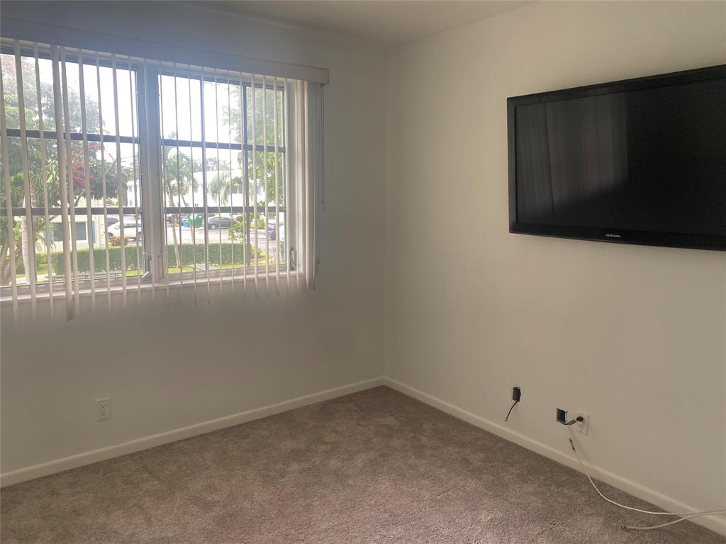 1821 Northeast 62nd Street, Unit 432 Fort Lauderdale, FL 33308 - Photo 3 of 29 a view of an empty room with a window