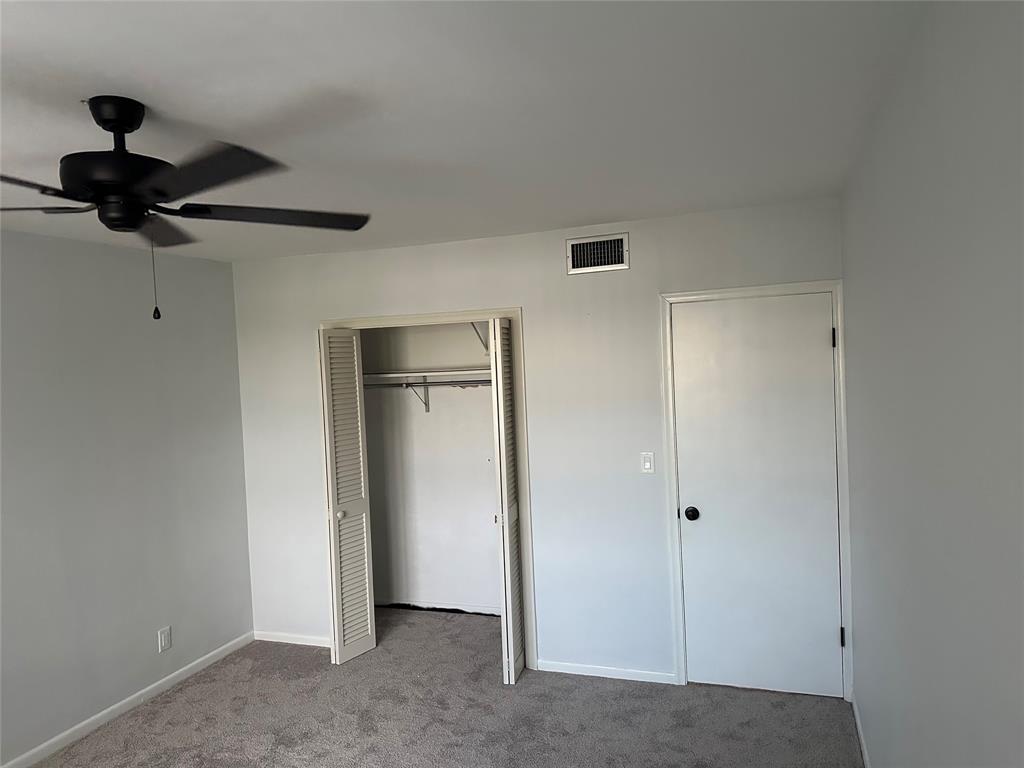 1821 Northeast 62nd Street, Unit 432 Fort Lauderdale, FL 33308 - Photo 5 of 29 a view of a chandelier fan and closet