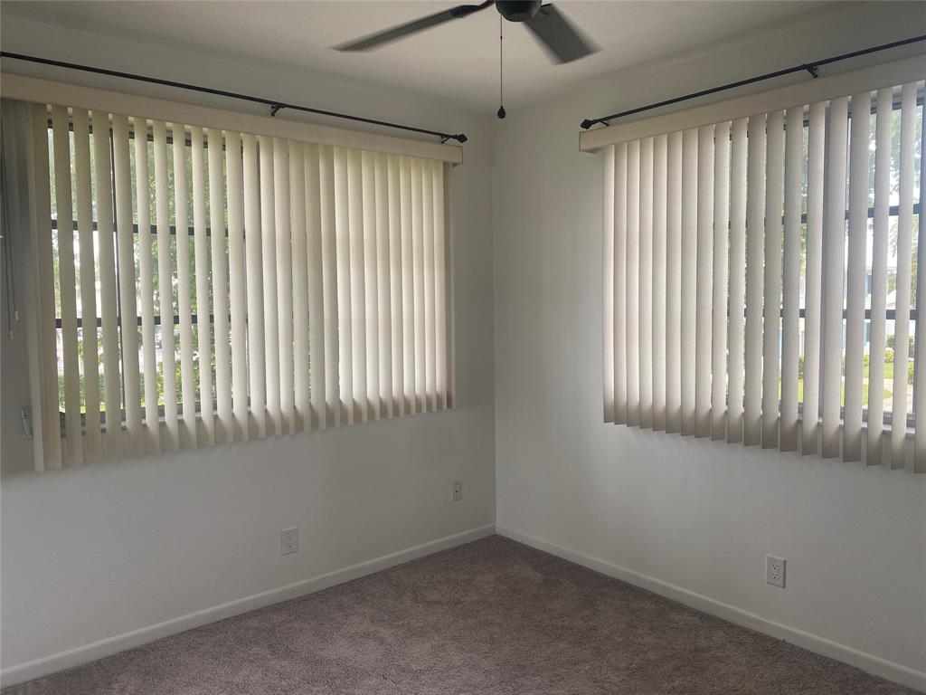 1821 Northeast 62nd Street, Unit 432 Fort Lauderdale, FL 33308 - Photo 10 of 29 a view of an empty room and window