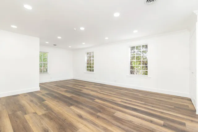 a bathroom with a double vanity sink a mirror and a bathtub