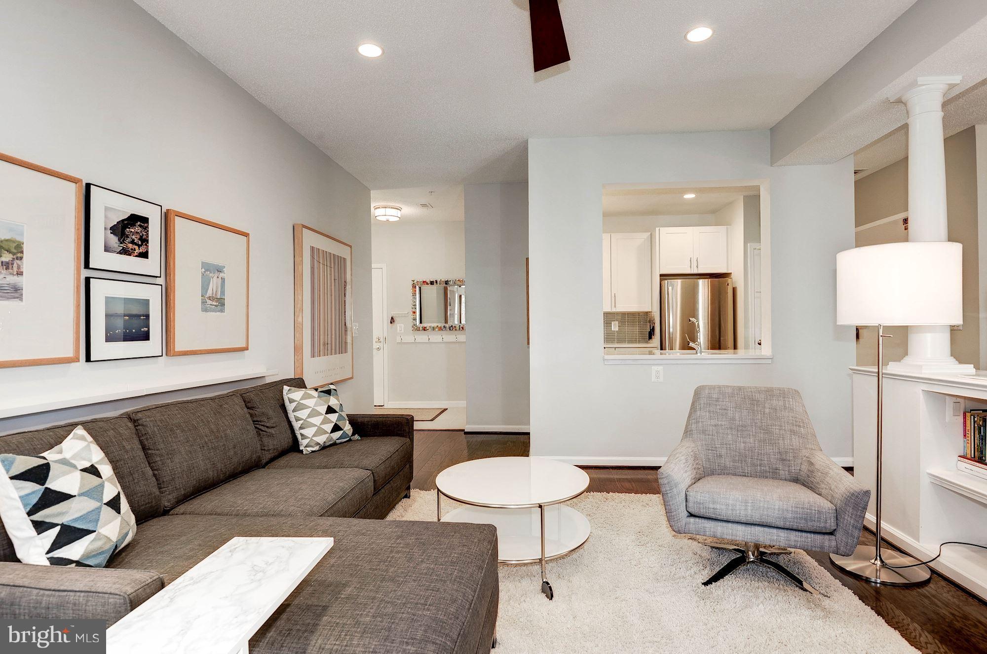 12016 Taliesin Place, Unit 22 Reston, VA 20190 - Photo 4 of 30 Living Room to Foyer