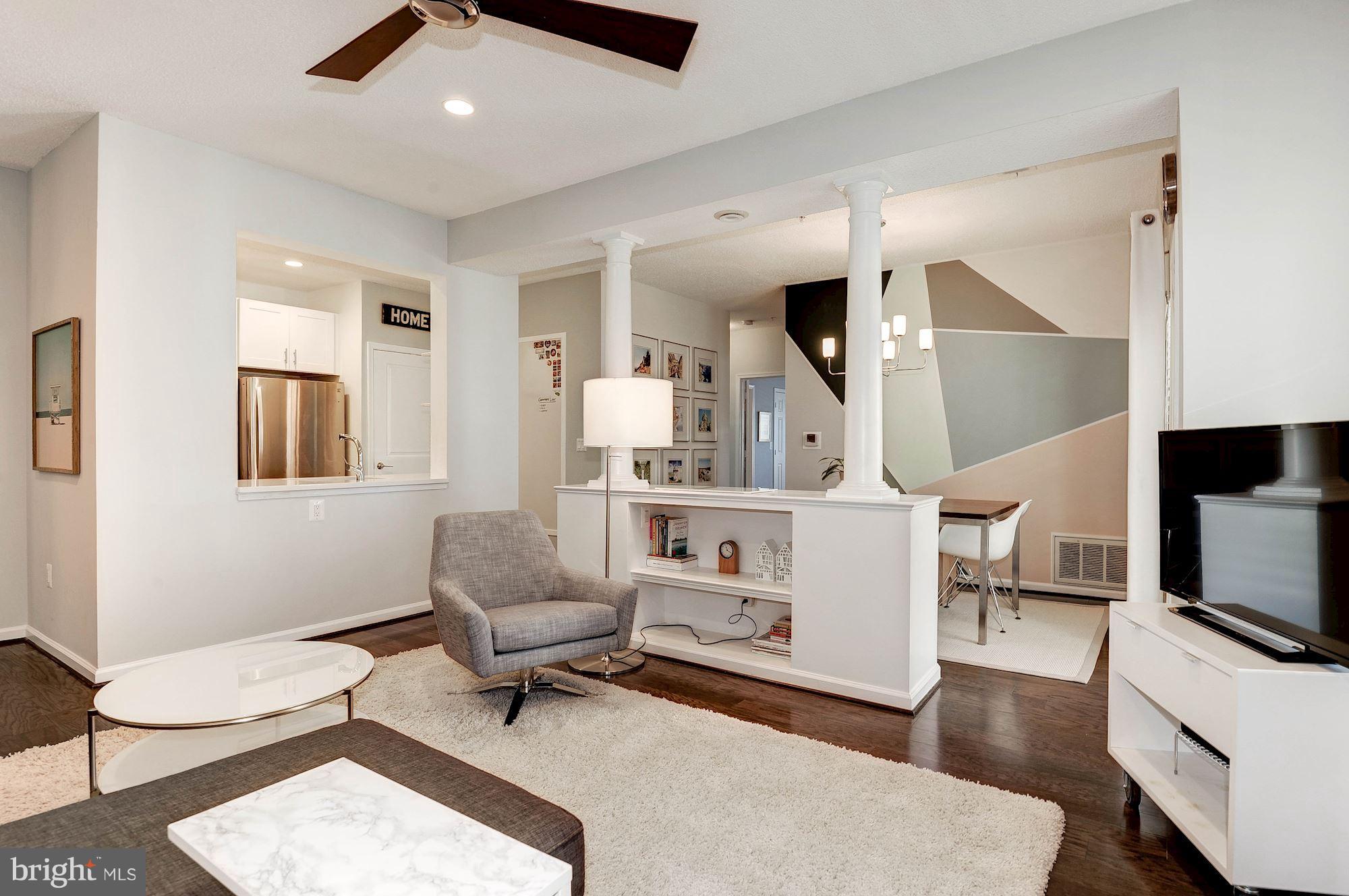 12016 Taliesin Place, Unit 22 Reston, VA 20190 - Photo 5 of 30 Living Room Opens to Dining and Kitchen
