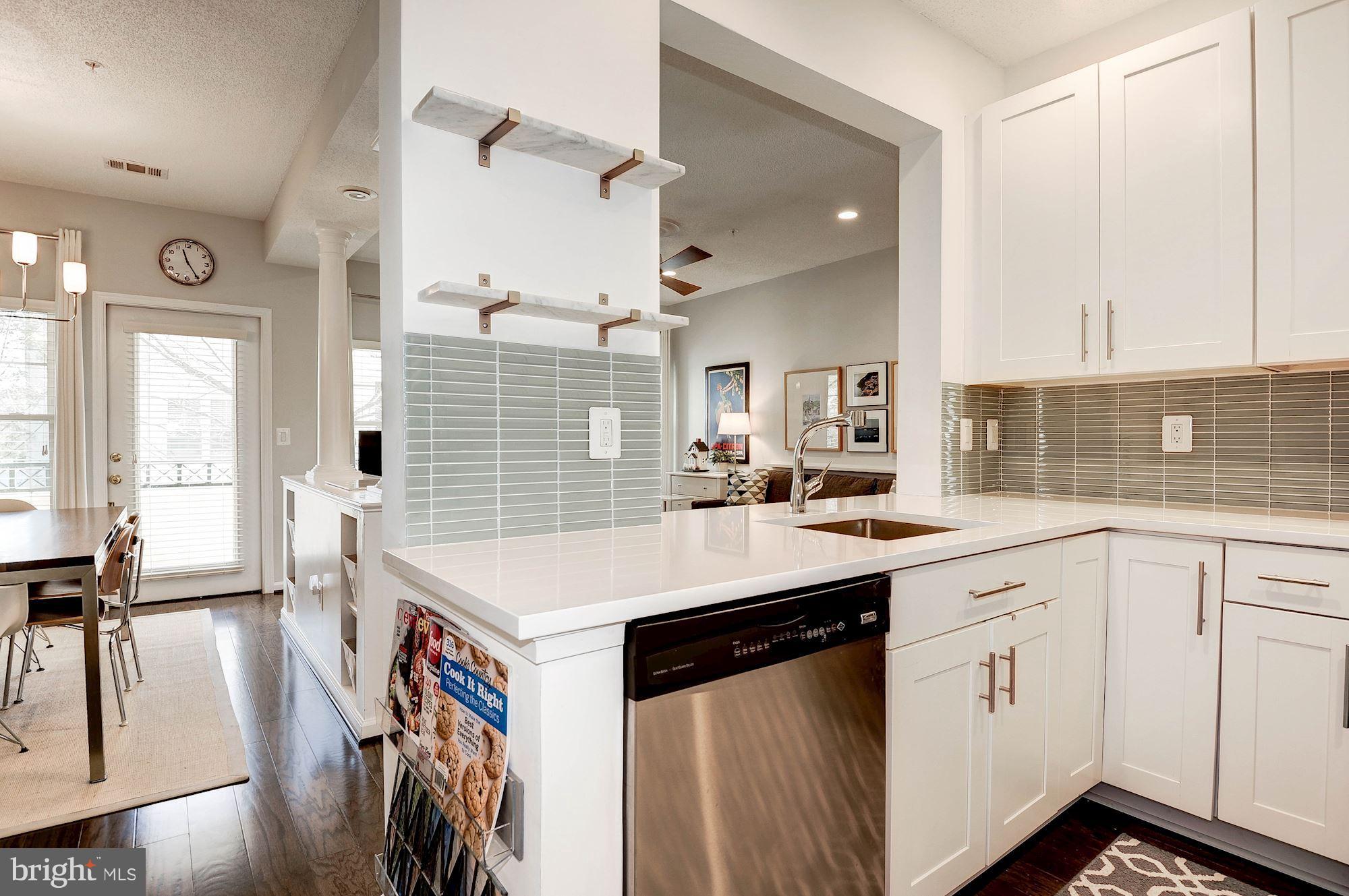 12016 Taliesin Place, Unit 22 Reston, VA 20190 - Photo 9 of 30 Quartz Counters, Tile Back and White Shaker Cabs