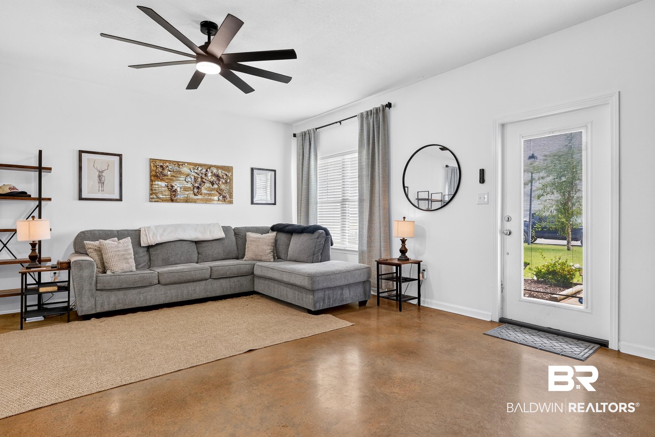 17419 Lewis Smith Drive Foley, AL 36535 - Photo 7 of 38 Spacious room featuring polished concrete flooring and a modern ceiling fan with integrated lighting