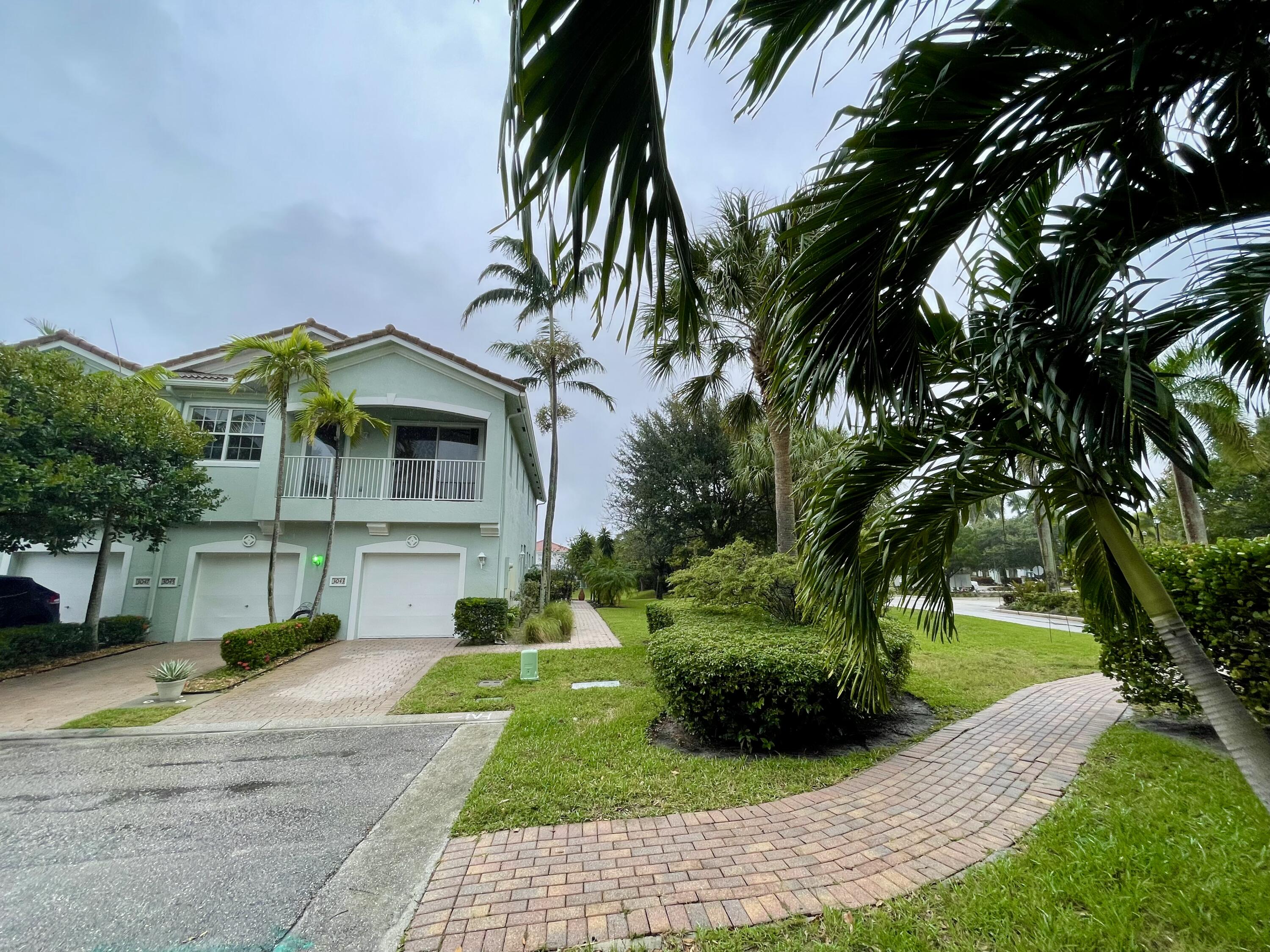 3043 Laurel Ridge Circle Riviera Beach, FL 33404 - Photo 2 of 35 FACADE