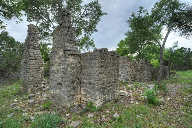 a aerial view of a house with lots of trees