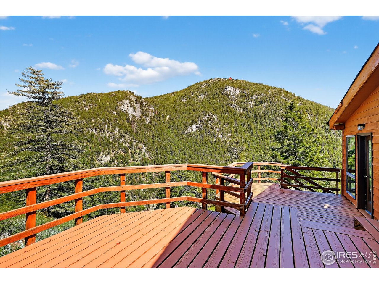 192 Nugget Hill Road Jamestown, CO 80455 - Photo 15 of 25 a view of balcony with wooden floor and seating space