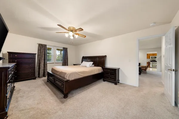 a bedroom with bed and window