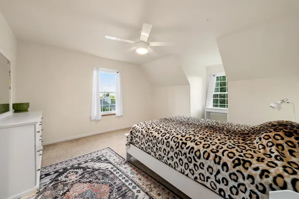 a kitchen with stainless steel appliances granite countertop a stove top oven a sink dishwasher a refrigerator and a microwave oven with wooden floor