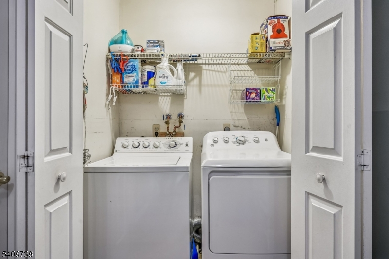 27 Espy Road, Unit A7 Caldwell, NJ 07006 - Photo 22 of 29 a utility room with dryer and washer