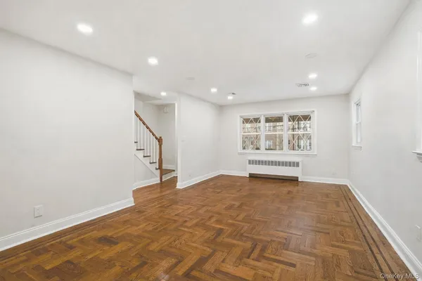 a view of an empty room with a window
