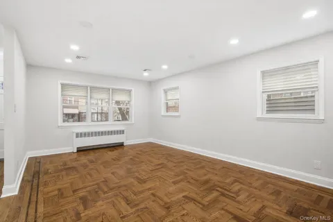 a large kitchen with stainless steel appliances a sink a stove and a refrigerator
