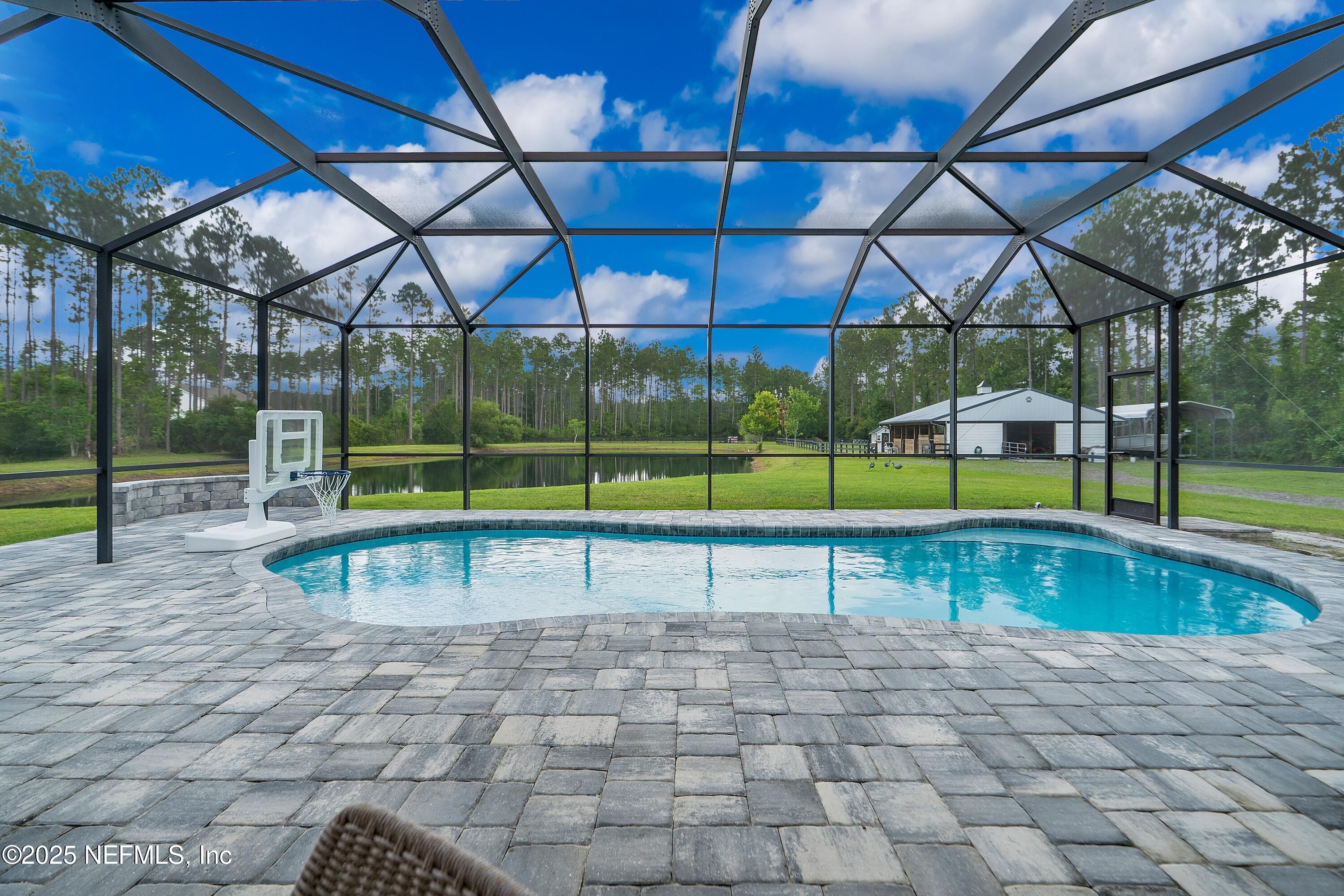 201 Burghley Avenue St. Augustine, FL 32092 - Photo 35 of 75 a view of swimming pool with a yard