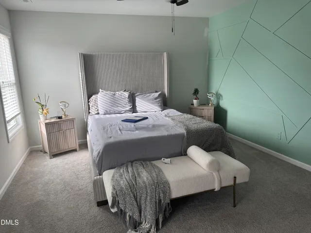 a bedroom with a bed and a couch