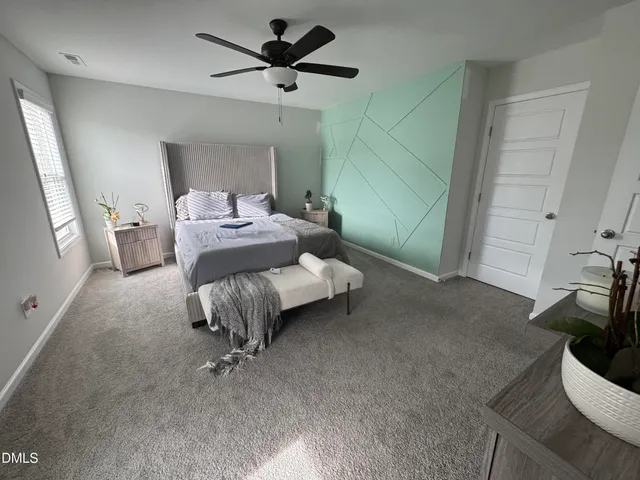 a room with a bed and a chandelier