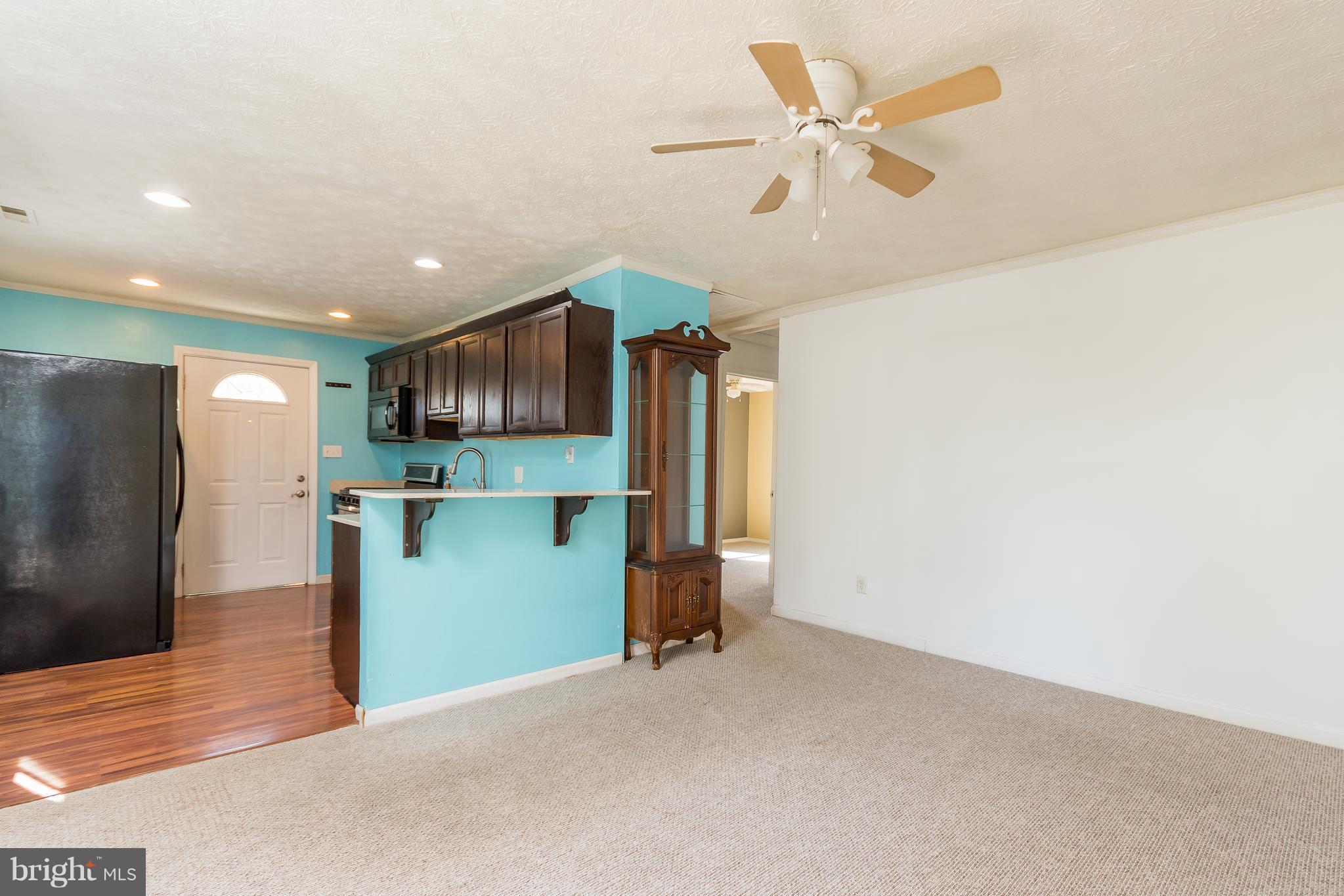 17299 Piney Point Road Piney Point, MD 20674 - Photo 7 of 16 Living room connecting to kitchen.