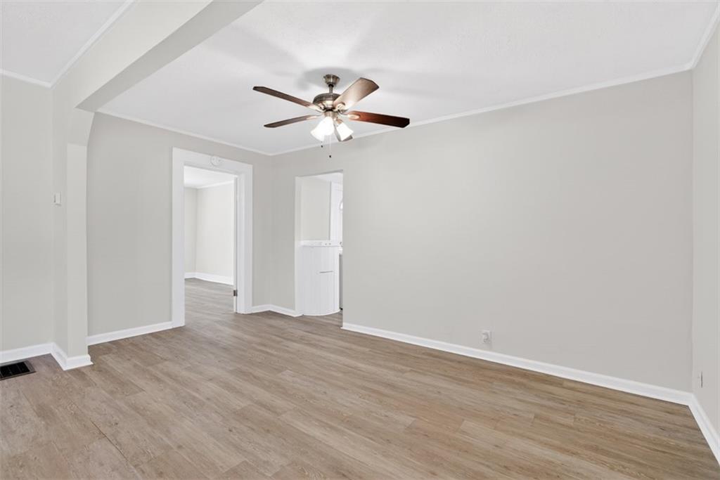 246 Spring Street Commerce, GA 30529 - Photo 5 of 23 a view of an empty room with wooden floor