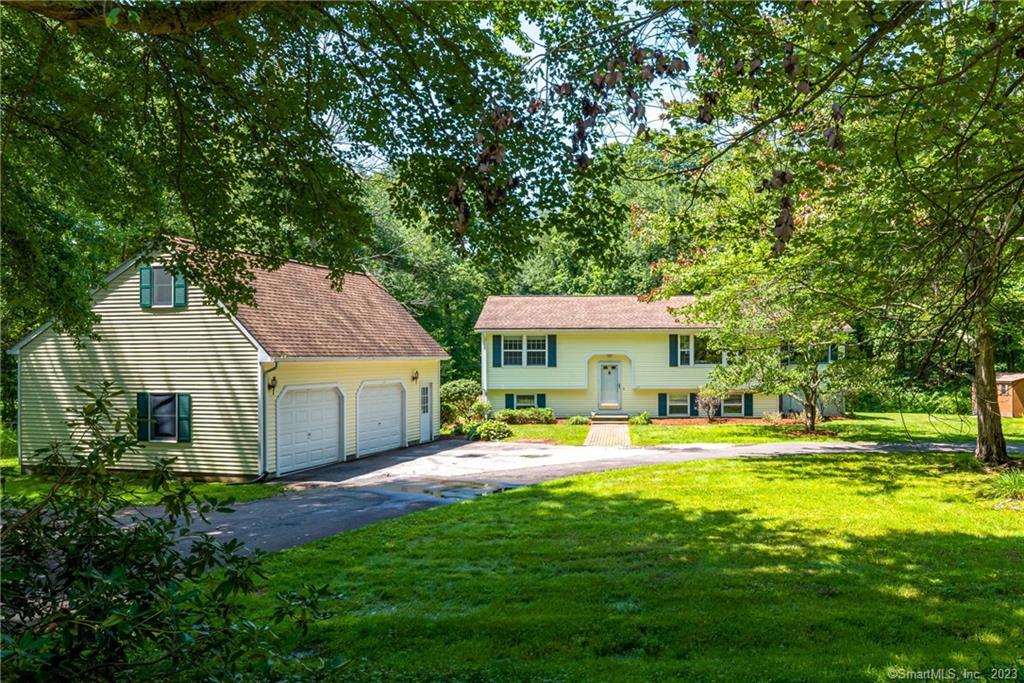 115 Nathan Hale Road Coventry, CT 06238 - Photo 1 of 1 a view of a house with big yard and a large tree