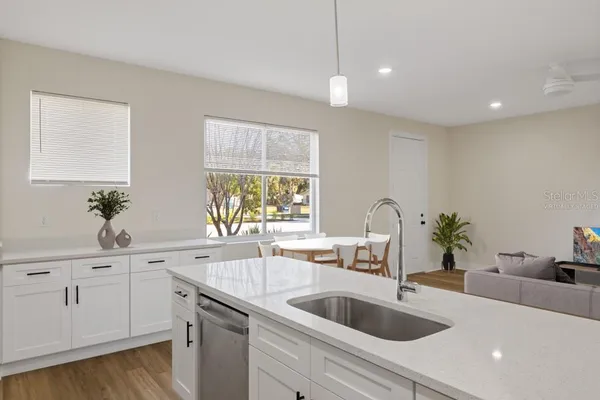 a kitchen with a sink and cabinets