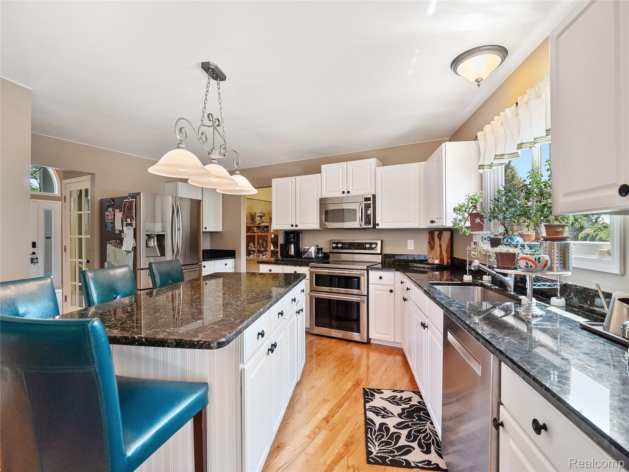 24417 Woodham Road Novi, MI 48374 - Photo 11 of 37 GRANITE COUNTERS AND STAINLESS STEEL APPLIANCES