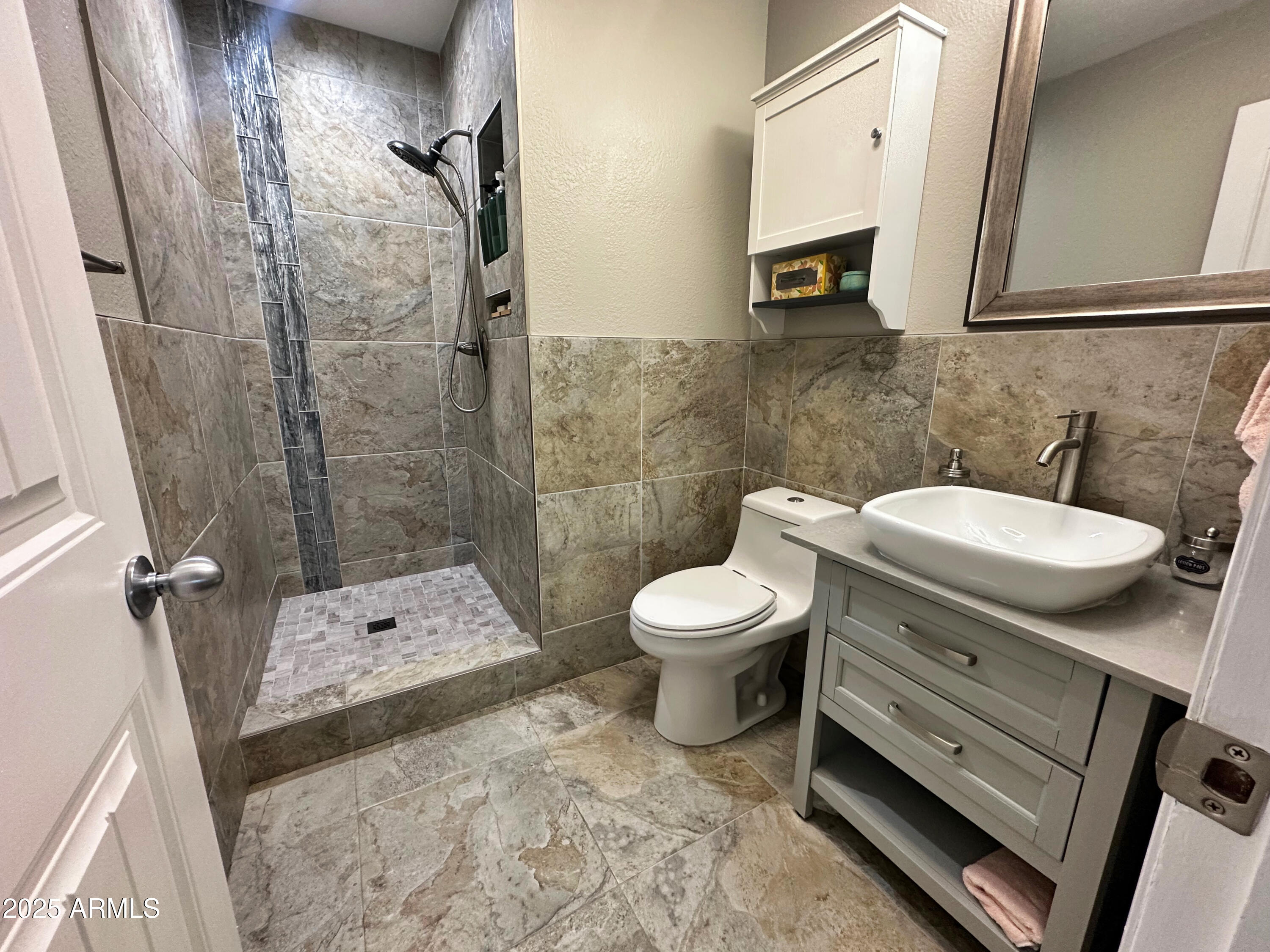 7732 West Wagoner Road Glendale, AZ 85308 - Photo 11 of 30 a bathroom with a sink a toilet and shower