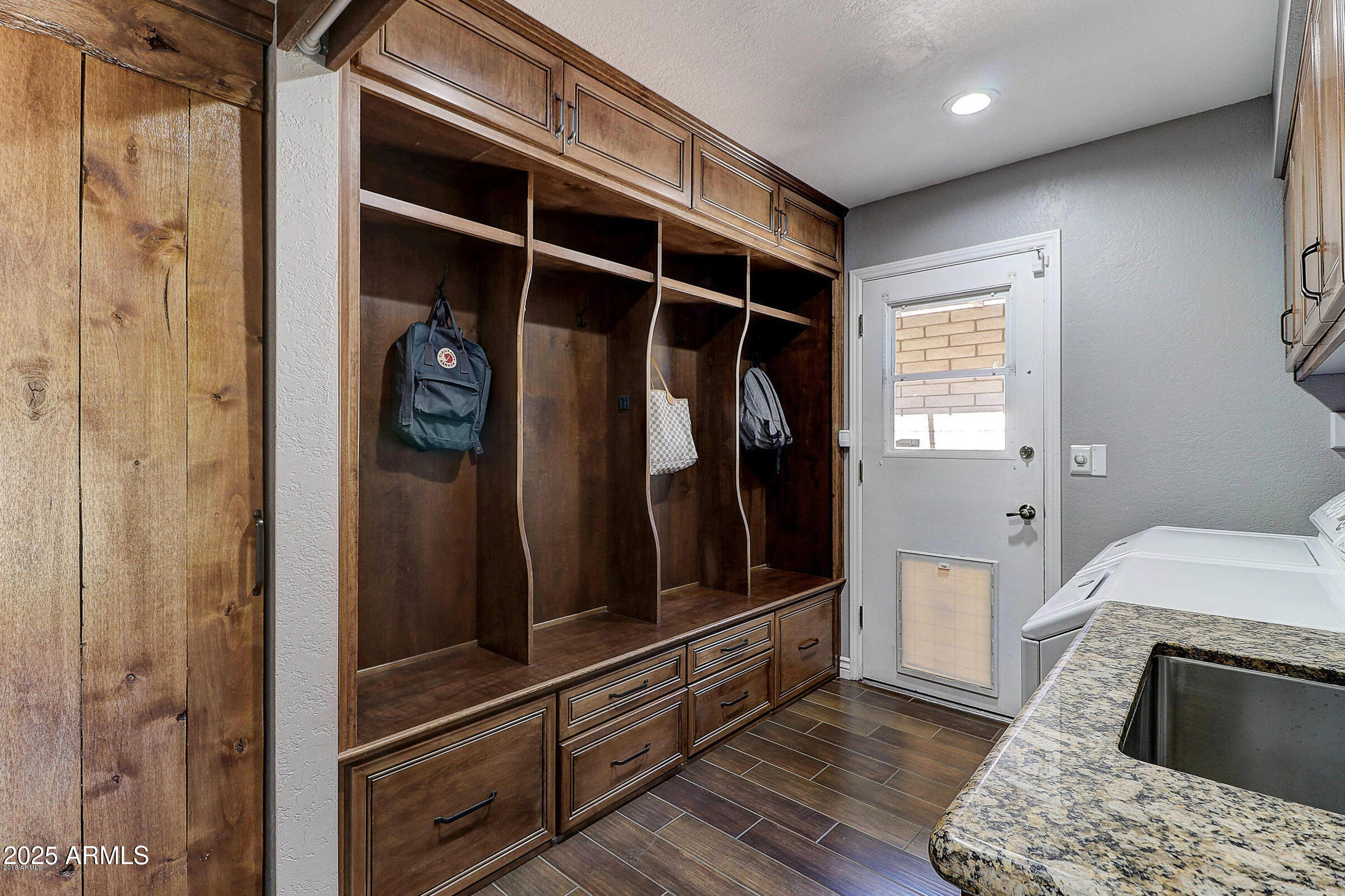 7732 West Wagoner Road Glendale, AZ 85308 - Photo 12 of 30 a view of walk in closet with clothes and shoes