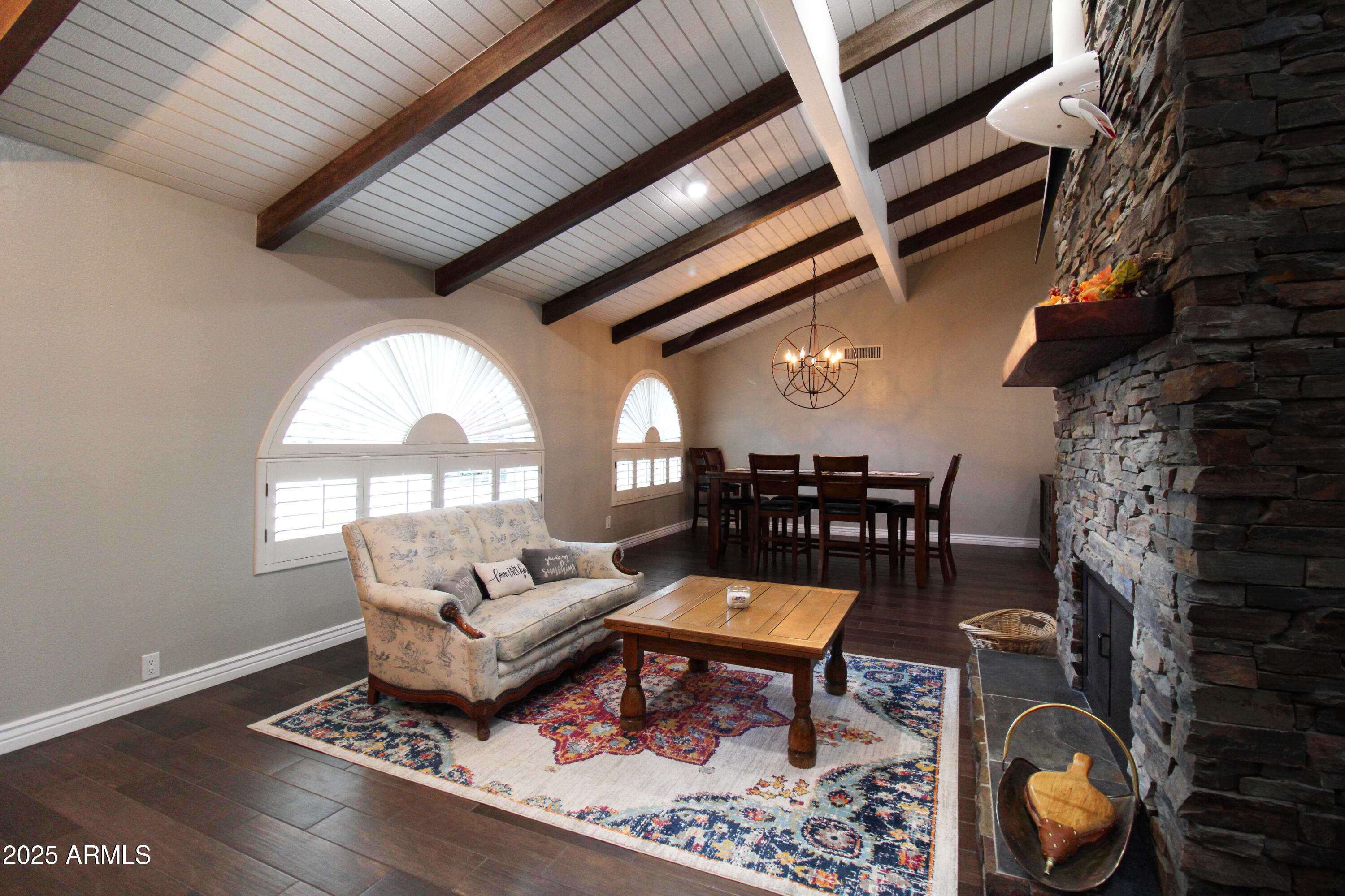 7732 West Wagoner Road Glendale, AZ 85308 - Photo 2 of 30 a living room with furniture and a fireplace