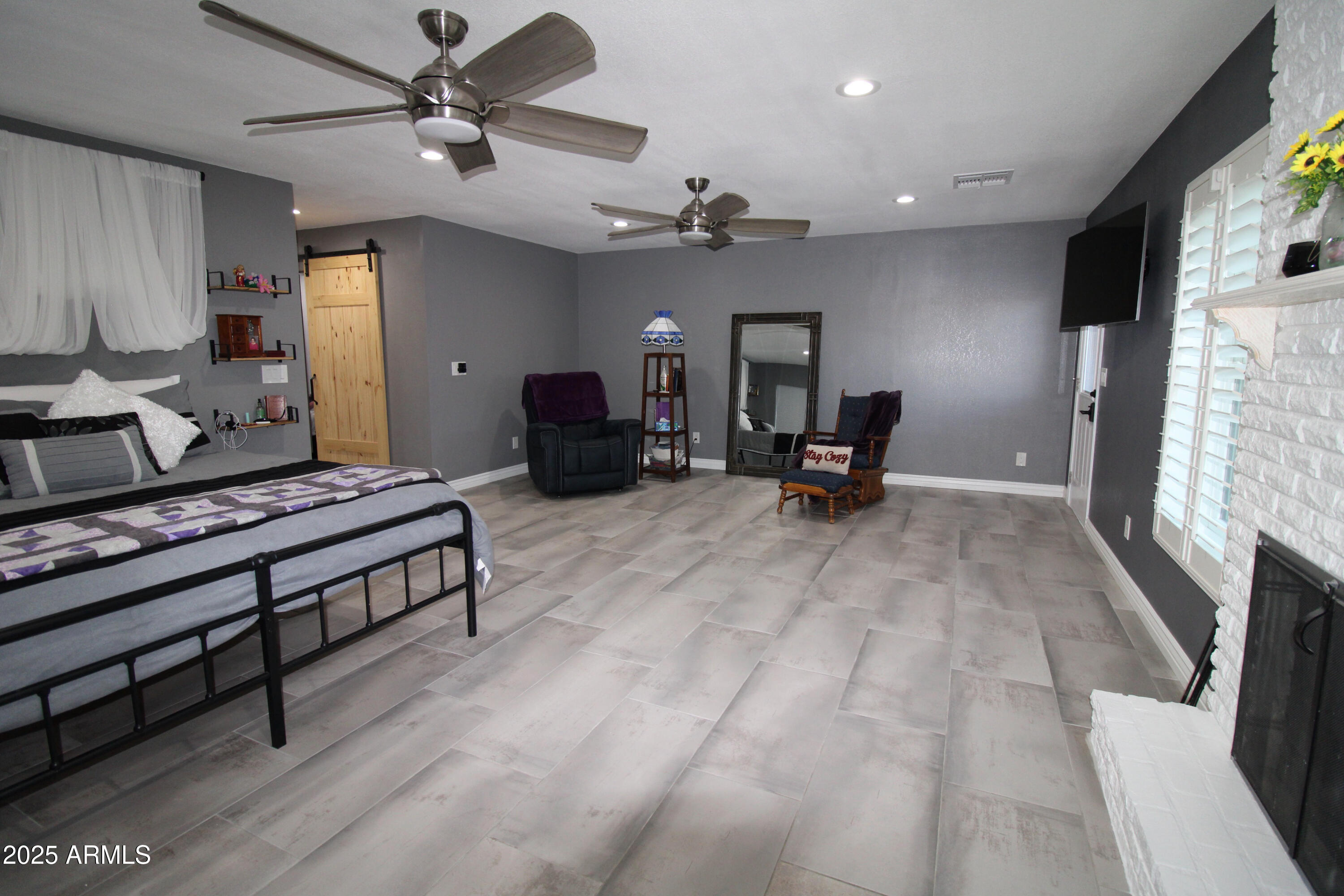 7732 West Wagoner Road Glendale, AZ 85308 - Photo 23 of 41 a living room with furniture and a fireplace