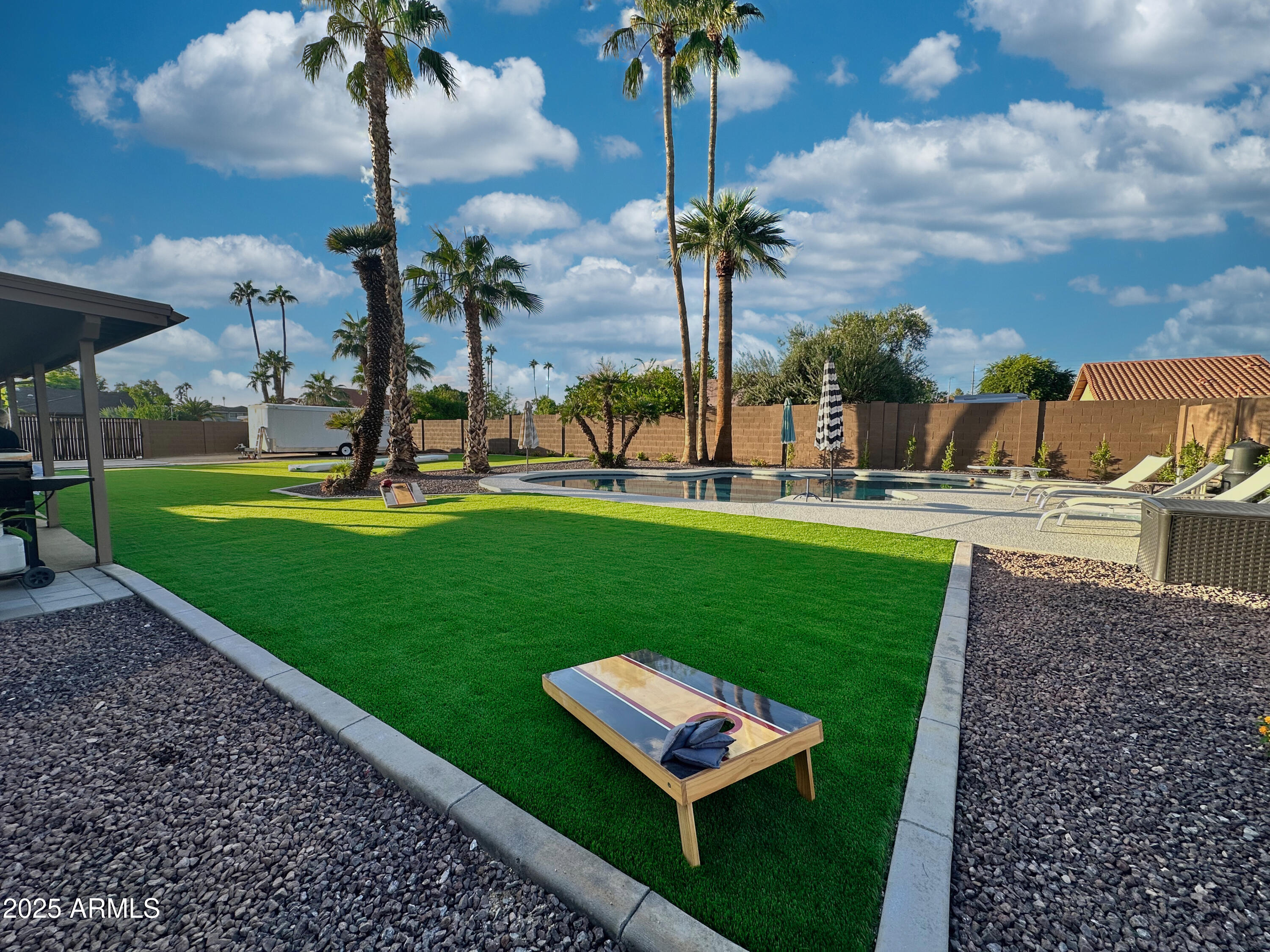 7732 West Wagoner Road Glendale, AZ 85308 - Photo 28 of 30 a view of a backyard with palm trees