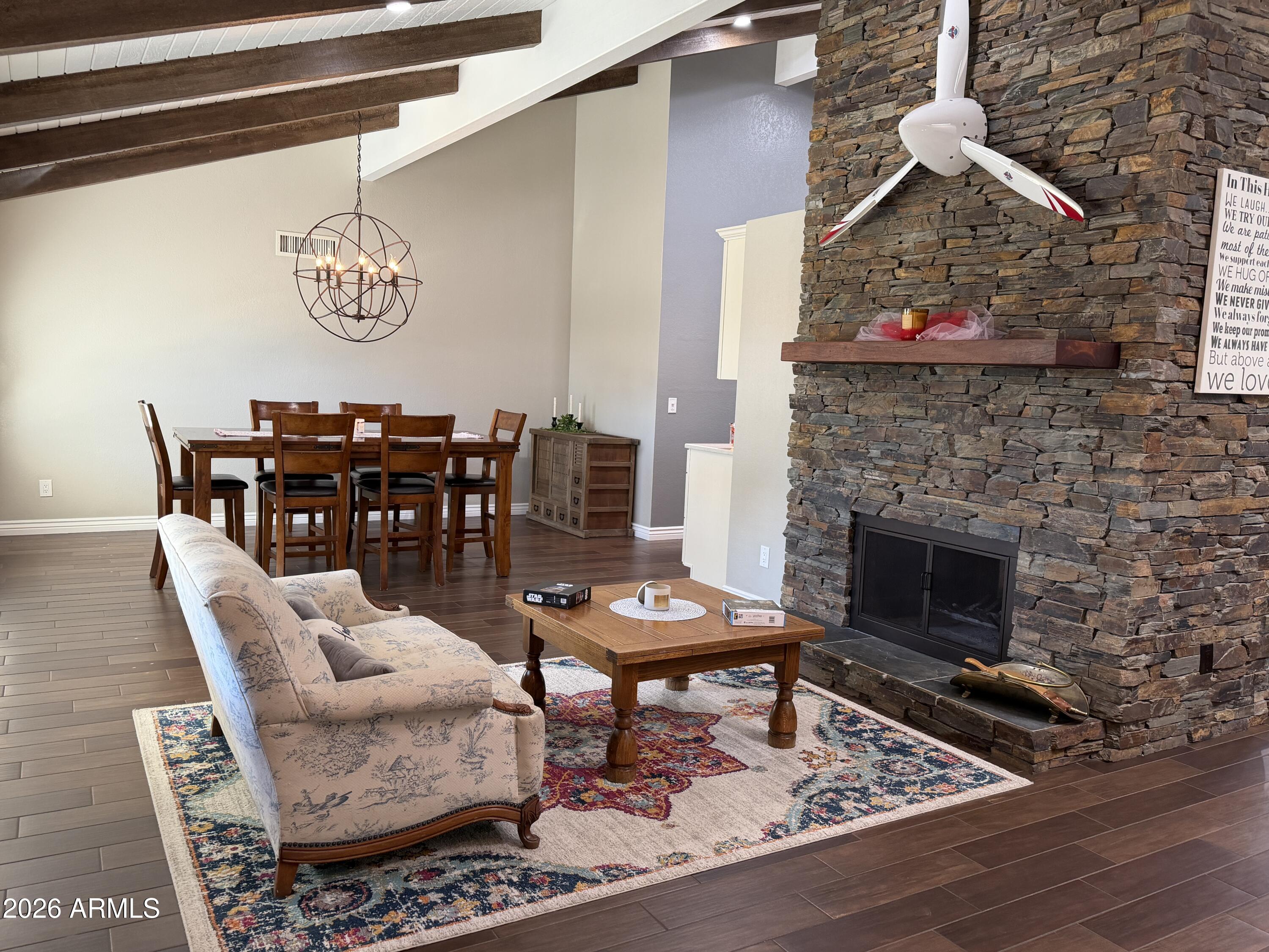 7732 West Wagoner Road Glendale, AZ 85308 - Photo 33 of 41 a living room with furniture and a fireplace
